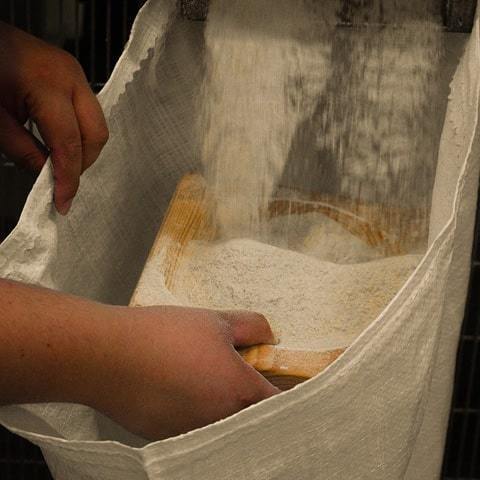 Pour flour into bags